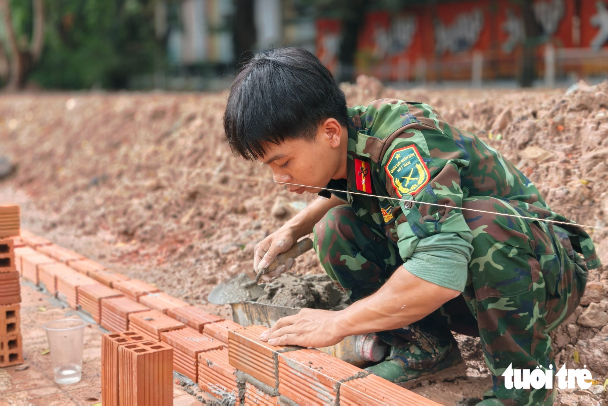 Khẩn trương chuẩn bị lễ truy điệu, an táng hài cốt liệt sĩ ở công viên Lê Thị Riêng - Ảnh 6.